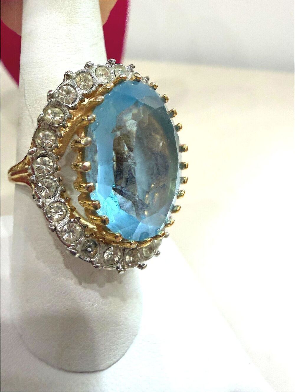 18KHBE Gold Ring with Large Blue Gemstone and Surrounding Clear Stones Size 8.5